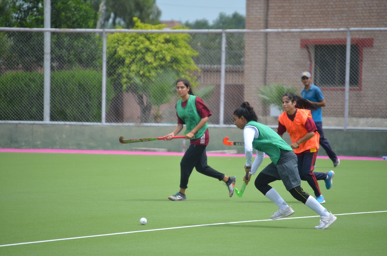 Female players participating in hockey talent hunt league with great zeal and spirit.